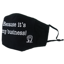 Load image into Gallery viewer, close up image black face mask on clear background. image shows front of mask with white print that says because it&#39;s my business across the top front and the bottom right has tabitha brown&#39;s logo of her head wearing earrings and her name in cursive. far right of image shows adjustable ear straps on mask.
