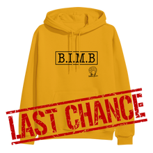 Load image into Gallery viewer, image of gold pullover hoodie on clear background. hoodie has full chest print in black that has a rectangle, and inside that in capital letters says B I M B and outside the rectangle on the bottom right is tabitha brown&#39;s logo of her head wearing earrings and her name in cursive. over the bottom part of the image in large red text says last chance.
